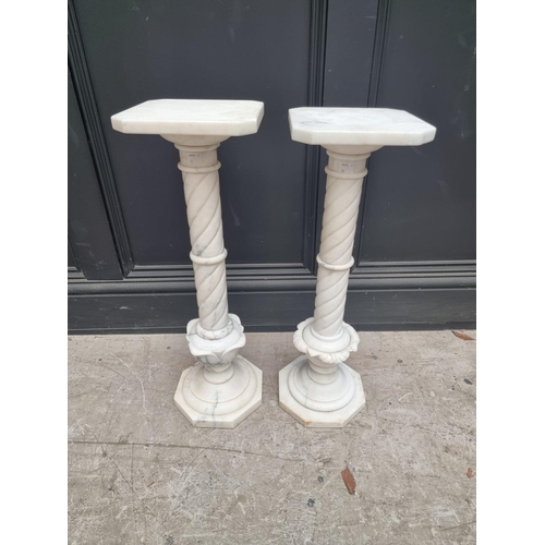 1332 - A near pair of white marble pedestals, 62cm high.