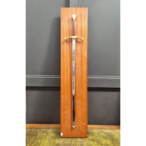 1342 - A modern twin handled broadsword, by Wilkinson, total length 108cm, on wall mounted display stand.&n... 