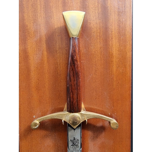 1342 - A modern twin handled broadsword, by Wilkinson, total length 108cm, on wall mounted display stand.&n... 