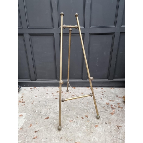 1348 - A brass easel, 153cm high. 