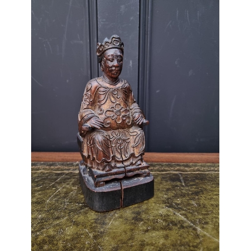 1365 - A Chinese carved and giltwood figure of a seated lady, late Qing, 22.5cm high.