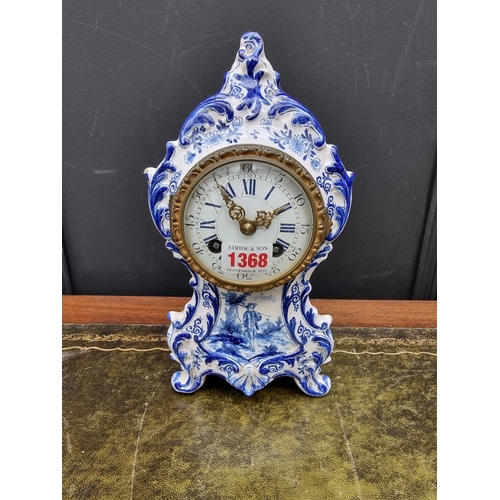 1368 - An antique French faience mantel clock, by Maple & Co Ltd, Paris, 26cm high, with pendulum.... 