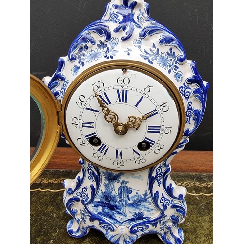 1368 - An antique French faience mantel clock, by Maple & Co Ltd, Paris, 26cm high, with pendulum.... 