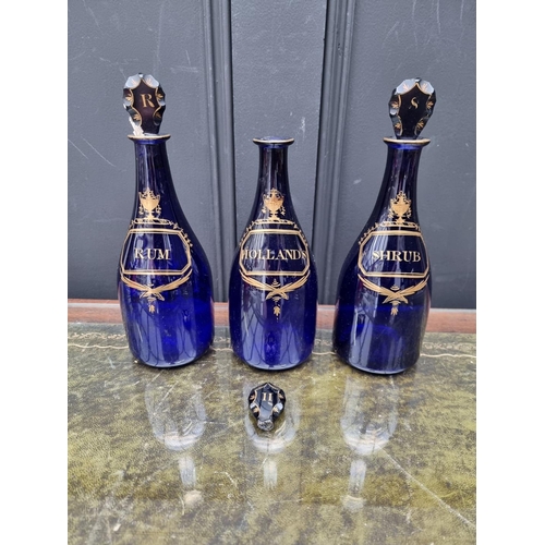 1376 - A set of three Georgian Bristol blue glass decanters and stoppers, 25cm high, (one stopper broken).&... 