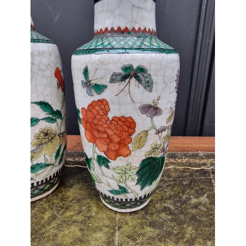 1378 - A pair of Chinese famille verte crackle glaze vases, 25cm high.