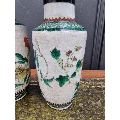 1378 - A pair of Chinese famille verte crackle glaze vases, 25cm high.