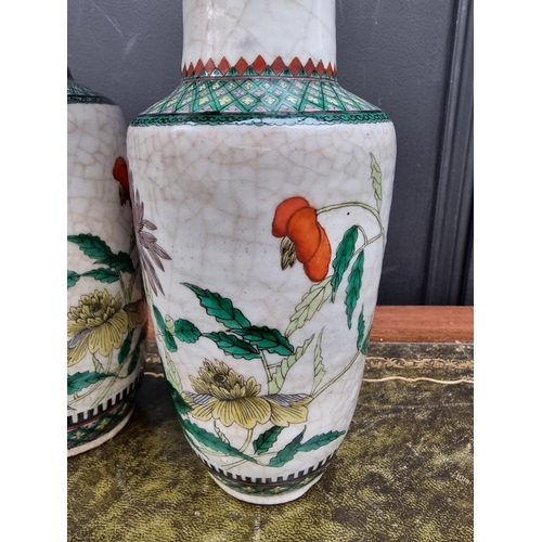 1378 - A pair of Chinese famille verte crackle glaze vases, 25cm high.