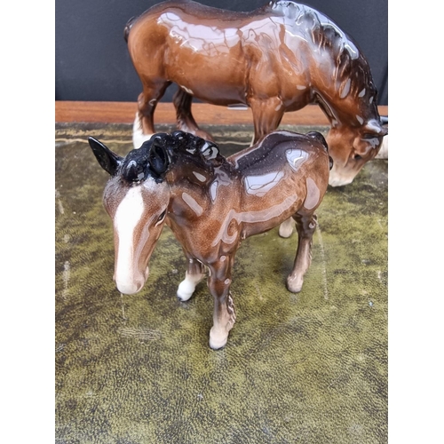 1382 - A Poole pottery commemorative plate, 27.5cm diameter; together with three Beswick horses. (4)... 