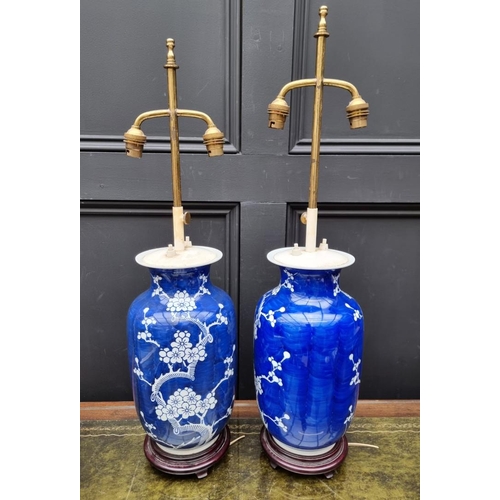 1383 - A pair of Chinese blue and white pottery adjustable table lamps, height excluding fitting 31cm. ... 