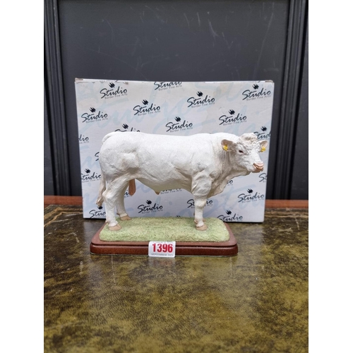 1396 - A Border Fine Arts Charolais bull, model A26091, on wood stand, 21cm wide, boxed. ... 