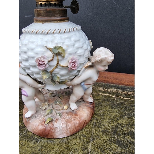 1408 - A Sitzendorf porcelain oil lamp, height including chimney 38cm, (shade possibly associated).... 