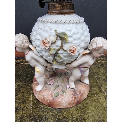 1408 - A Sitzendorf porcelain oil lamp, height including chimney 38cm, (shade possibly associated).... 