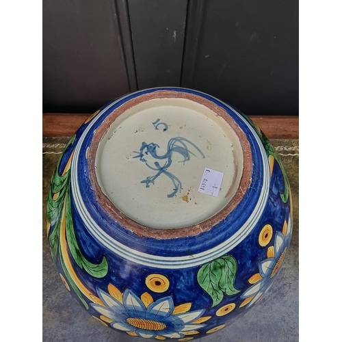 1415 - A large Cantagalli pottery ovoid vase, painted with sunflowers, 32.5cm high.