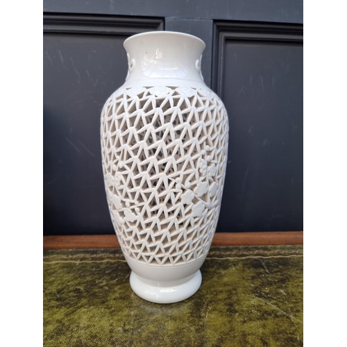 1417 - Two similar Chinese blanc de chine reticulated vase form lamp bases, largest 35.5cm high. ... 