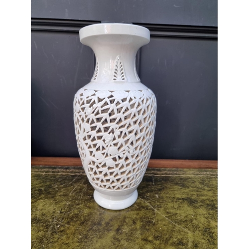 1417 - Two similar Chinese blanc de chine reticulated vase form lamp bases, largest 35.5cm high. ... 