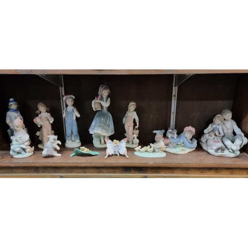 1425 - Eleven Lladro figures, largest 27cm high, eight boxed; together with another Nao figure group, boxed... 