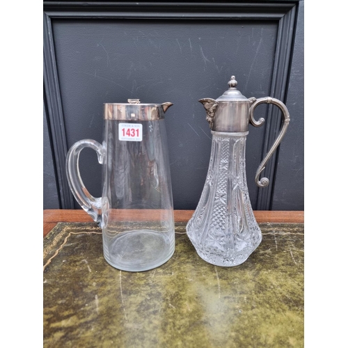 1431 - An electroplate mounted lemonade jug, 25.5cm high; together with a glass claret jug. (2)... 