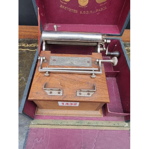 1432 - A vintage French walnut and nickel plated cigarette rolling machine, in fitted box. ... 