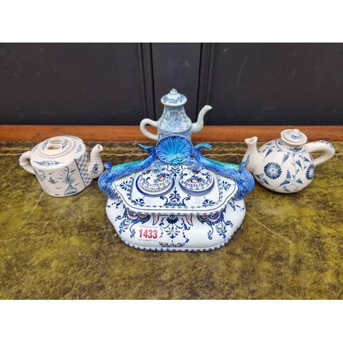 1433 - A Gien faience desk stand, 21cm wide; together with a small antique Chinese blue and white wine pot ... 