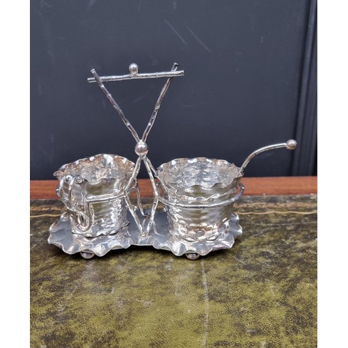 1435 - An electroplated cream and sugar set, by Moore & Co, Dublin, 17.5cm wide. ... 