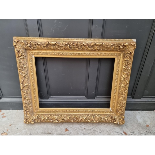 1455 - A large antique gilt gesso frame, rebate 61 x 85.5cm.