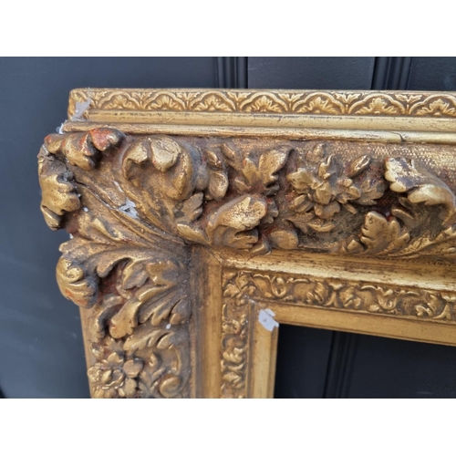 1455 - A large antique gilt gesso frame, rebate 61 x 85.5cm.