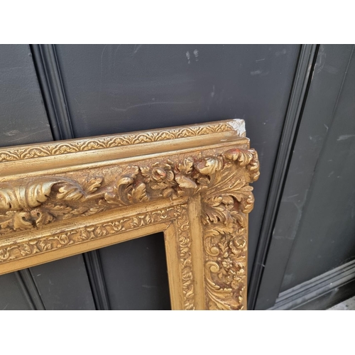 1455 - A large antique gilt gesso frame, rebate 61 x 85.5cm.