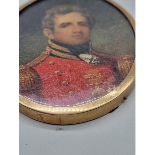 1465 - British School, early 19th century, bust length portrait miniature of a officer in a scarlet tu... 