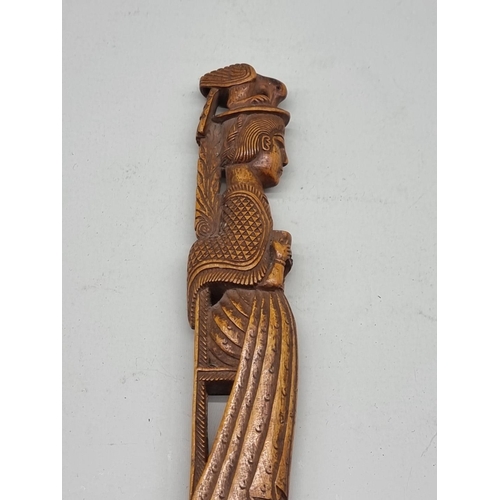 1485 - A good Eastern carved wood pointer, 37cm long.