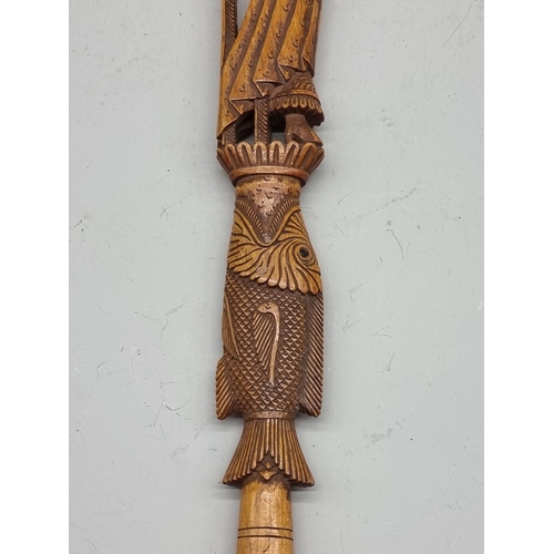 1485 - A good Eastern carved wood pointer, 37cm long.