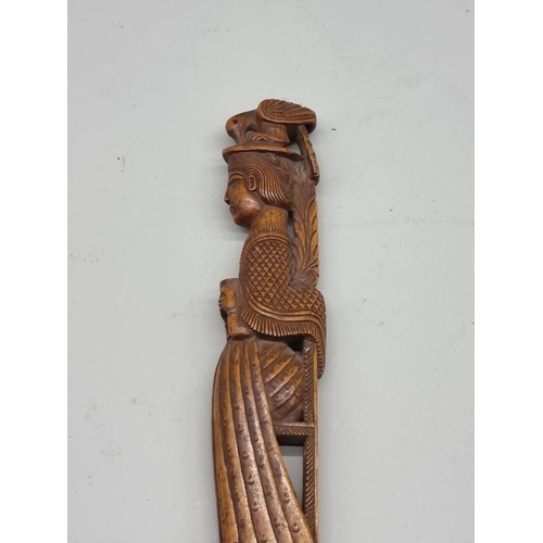 1485 - A good Eastern carved wood pointer, 37cm long.