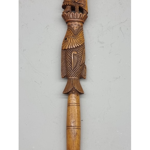 1485 - A good Eastern carved wood pointer, 37cm long.