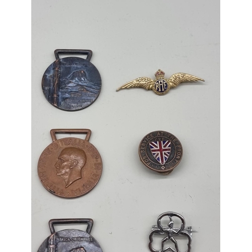 1486 - Medals: a collection of badges and medals, to include Masonic examples. 