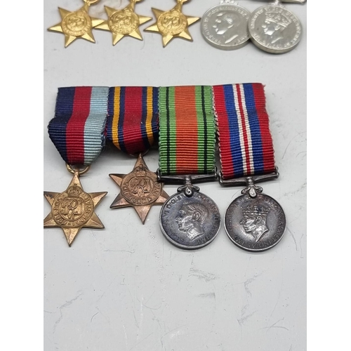 1487 - Medals: a small quantity of miniature medals. 