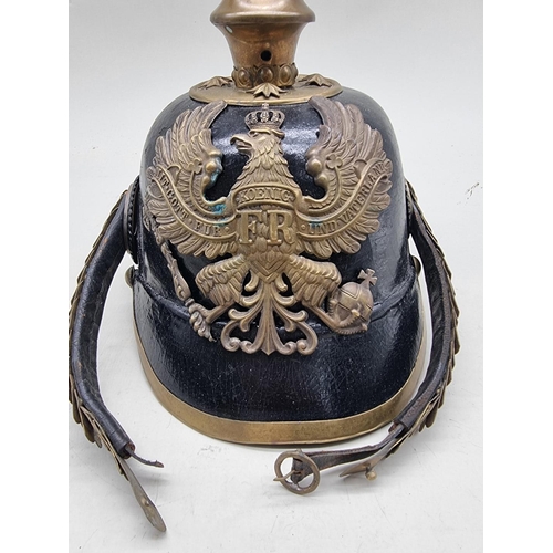 1517 - A Prussian infantry NCO's pickelhaube, with eagle helmet plate and brown leather liner.... 