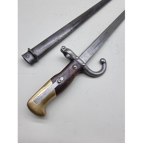 1523 - A French Model 1878 'Gras' sword bayonet and scabbard, by L Deny Paris, with 52cm blade.... 