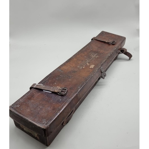 1528 - An antique leather shotgun case, labelled 'E M Riley & Co,...London', 81cm wide.... 