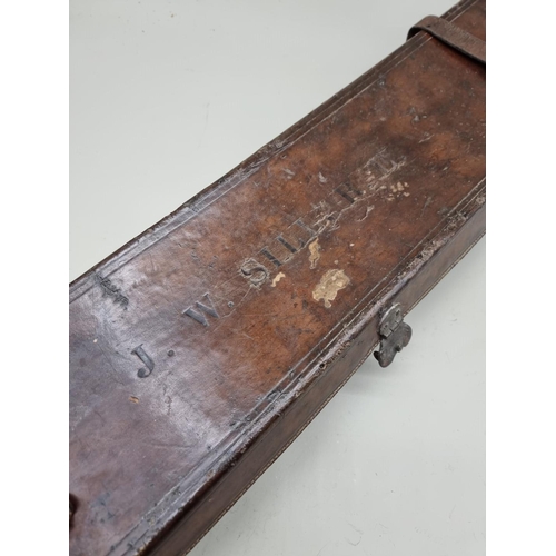 1528 - An antique leather shotgun case, labelled 'E M Riley & Co,...London', 81cm wide.... 