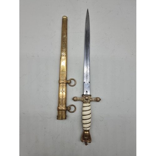 1533 - A German Third Reich M1938 Kriegsmarine officer's dagger and brass sheath, the blade inscribed W K C... 