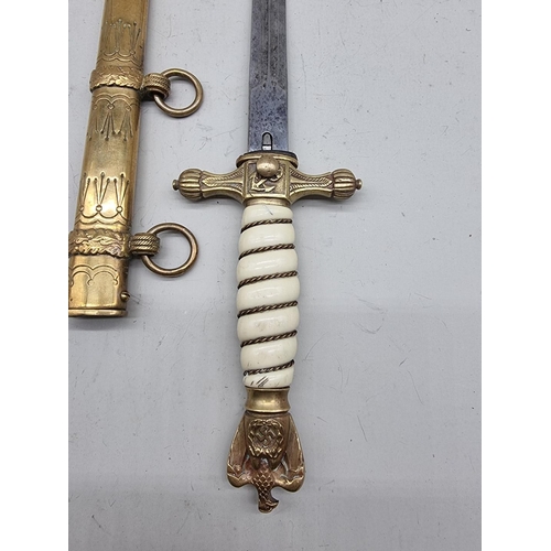 1533 - A German Third Reich M1938 Kriegsmarine officer's dagger and brass sheath, the blade inscribed W K C... 