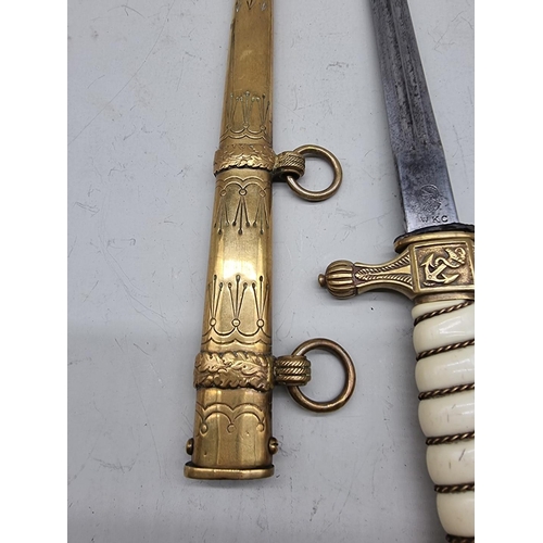 1533 - A German Third Reich M1938 Kriegsmarine officer's dagger and brass sheath, the blade inscribed W K C... 