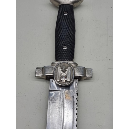 1535 - A German Third Reich DRK Red Cross dagger and sheath, with leather frog, saw back blade and hatchet ... 