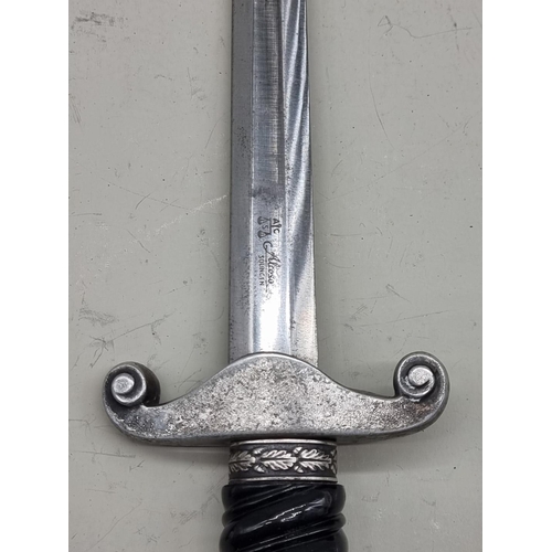 1538 - A German Third Reich first pattern Reichsbahn Railway dagger and steel sheath, the blade engraved 'A... 