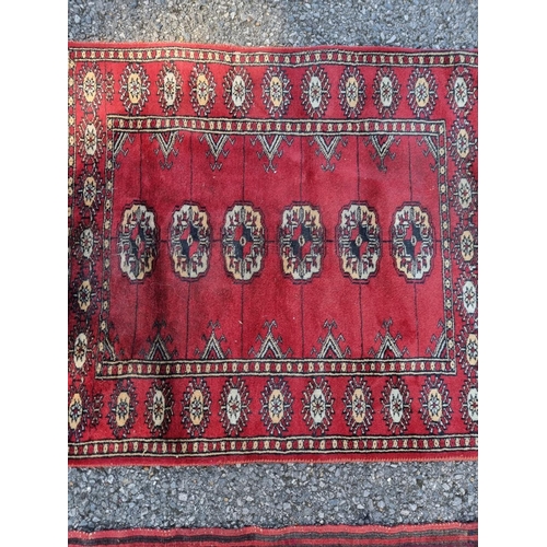 1132 - A tribal rug, 123 x 80cm; together with three other rugs.