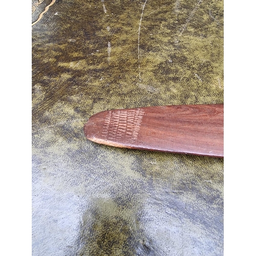 1522 - Ethnographica: an aboriginal boomerang, with carved decoration, 71cm wide.  ... 