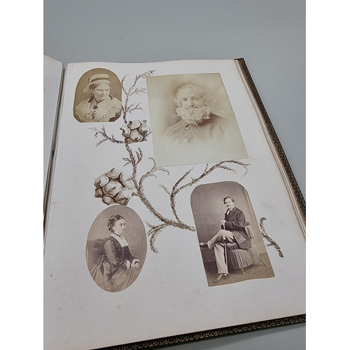 530 - VICTORIAN PHOTOGRAPH ALBUM: 19thc album of family portrait photographs, artistically arranged o... 