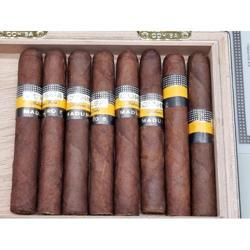 127 - Eight Cohiba Maduro 5 Secretos cigars, in ebonized box dated May 12.These cigars have been aged for ... 