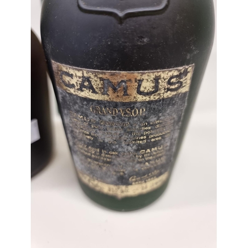 76 - Two bottles of VSOP Cognac, comprising: a 68cl Courvoisier, in card box; and a 24 fl.oz Camus. (2)... 