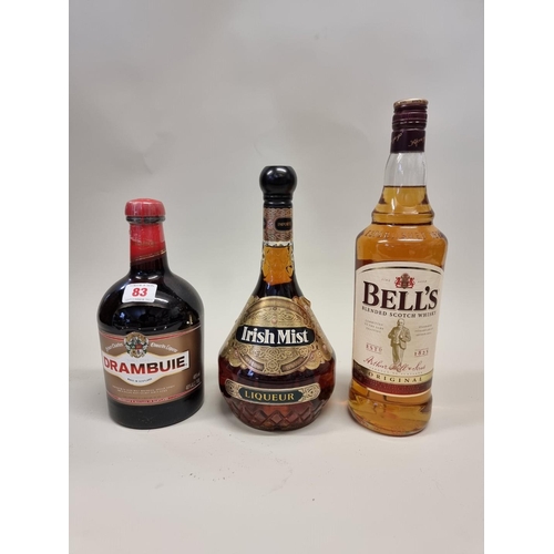 83 - A 1 litre bottle of Bell's blended Whisky; together with a 1 litre bottle of Drambuie; and a 1 litre... 