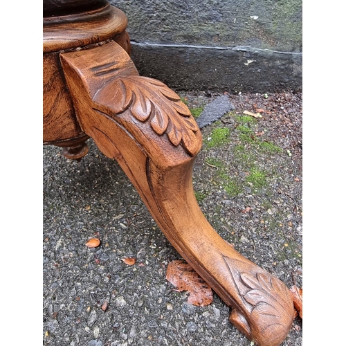 1055 - A carved elm adjustable tripod piano stool. 